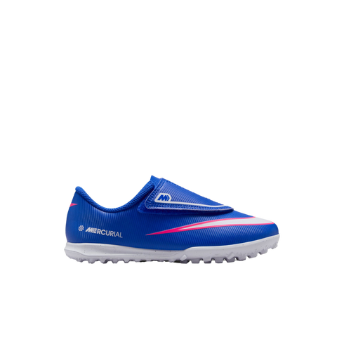 A blue Nike Mercurial soccer shoe with pink and white accents and a textured white sole, featuring a hook-and-loop strap closure.