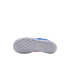 The bottom view of a white Nike turf shoe sole, featuring a dense pattern of small rectangular studs and a grey swoosh logo, set against a black background.