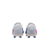 Rear view of white soccer cleats with blue and pink accents on a black background.