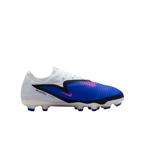 Side view of a Nike Phantom Flyknit soccer cleat with a white heel, blue textured forefoot, black graphic details, and pink accents on a white soleplate with blue studs.