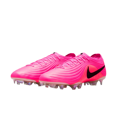 A pair of bright pink Nike soccer cleats with a black swoosh and iridescent studs, set against a white background.