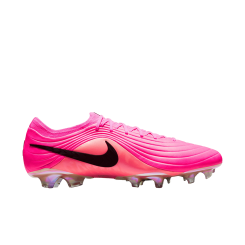 A vibrant pink Nike soccer cleat featuring a black swoosh and wavy textured upper, shown in profile against a plain white background.