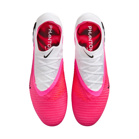 Top-down view of bright pink and white Nike Phantom soccer cleats.
