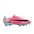 Side view of a pink and white Nike soccer cleat with a large black swoosh and a shiny, iridescent multi-colored sole plate.