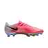 Side profile of a pink and white Nike soccer cleat with an iridescent sole plate and black swoosh.
