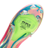 Close-up of an iridescent Nike soccer cleat soleplate with a neon green Air Zoom unit labeled "ENGINEERED FOR MAX SPEED."