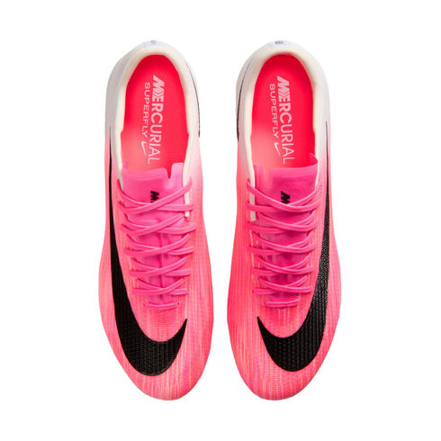 Top-down view of a pair of bright pink Nike Mercurial Superfly soccer cleats with black swooshes and matching pink laces.
