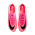 Top-down view of a pair of bright pink Nike Mercurial Superfly soccer cleats with black swooshes and matching pink laces.