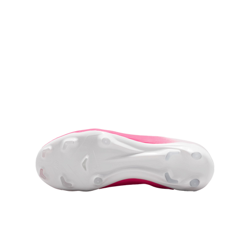 A bottom-up view of a pink and white soccer cleat, featuring its white soleplate and various studs.