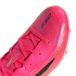 Close-up of a bright pink soccer cleat with gold accents and the black "F50" logo on its upper. The cleat features pink laces and is shown against a white background.