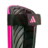 Close-up of a pink Adidas shin guard showing the black padded interior and an elastic strap with a pink logo.
