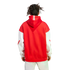 Back view of a person with dreadlocks wearing a red and white Arsenal hoodie and light-colored pants against a white background.