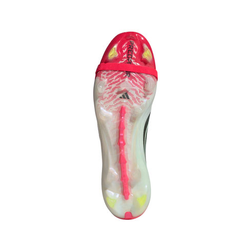 A soleplate view of an Adidas Predator soccer cleat featuring a translucent white and pink design, yellow studs, and a red forefoot strap.