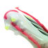 Close-up of an Adidas Predator soccer cleat's translucent white soleplate featuring lime green studs and a red central power spine.