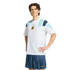 A man wears a white Adidas Argentina t-shirt and blue shorts, posing against a white background.