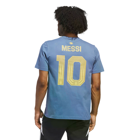 Rear view of a person with dark curly hair wearing a blue t-shirt with gold "MESSI 10" on the back and black athletic shorts, set against a black background.