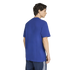 Back view of a man wearing a royal blue crewneck t-shirt and navy blue athletic shorts with white side stripes, against a white background.