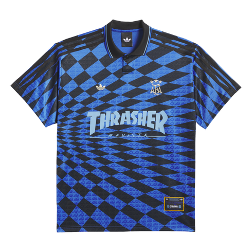 Blue and black checkered Adidas polo shirt featuring gold AFA and trefoil logos, and a large light blue "Thrasher Revista" graphic across the front.