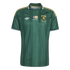 Green Adidas South Africa soccer jersey with vertical zig-zag stripes, gold shoulder stripes, white collar trim, and official team logos on the chest.