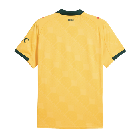 Rear view of a yellow AC Milan jersey with dark green collar and trim. Features "MILAN" text on the upper back and a subtle geometric pattern.