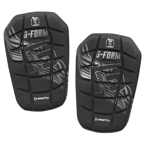 Pair of black G-FORM shin guards with silver graphics and SmartFlex branding.