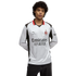 Man in a white AC Milan long-sleeve soccer jersey with red and black accents and 'Emirates Fly Better' logo, against a black background.