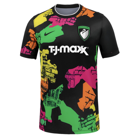 Black soccer jersey with colorful neon brick-patterned shapes. Features a Boston swan crest, black Nike swoosh, and white T.J. Maxx sponsor logo in the center.