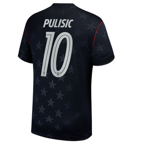 A navy blue soccer jersey viewed from the back, featuring the name "PULISIC" and the number "10" in white. The jersey has a subtle all-over pattern of stars and thin red piping along the shoulder seams.