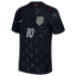 A black USA national team soccer jersey featuring a subtle all-over tonal star pattern. The jersey has a white Nike swoosh on the right chest, the USA national team crest on the left, and a white number 10 in the center. Thin red accents are visible along