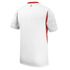 Back view of a white sports jersey with red side panels and collar, featuring patterned short sleeves and a small red logo on the upper back.