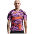 A bald man with arm tattoos wearing a vibrant purple and orange swirl-patterned athletic shirt.